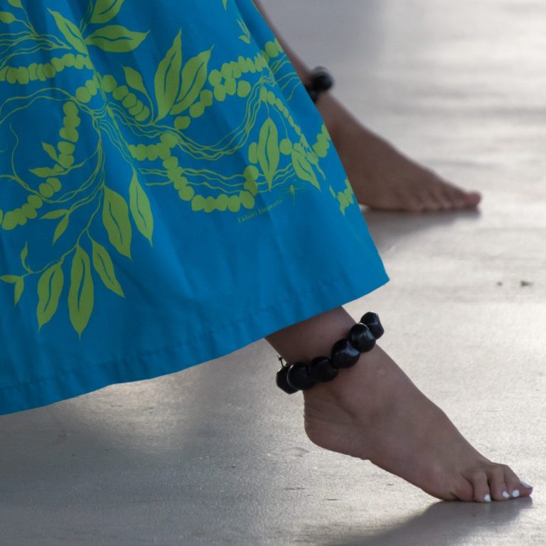 Legs of hula dancers performing in Waikoloa, Big Island, Hawaii